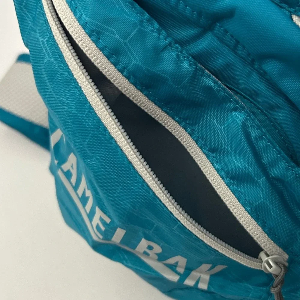 CamelBak Velocity Hydration Pack Teal Blue Reflective Hiking Running Bag 70oz